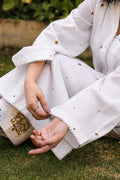 Alba cotton lawn suit — ivory long shirt with gold lace trim, scallop-border cuffs and diamond motifs, Summer Sanctuary by Sarah Tareen
