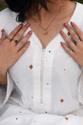 Alba lawn suit — back view of relaxed ivory print shirt with pastel medallion trouser, Sarah Tareen