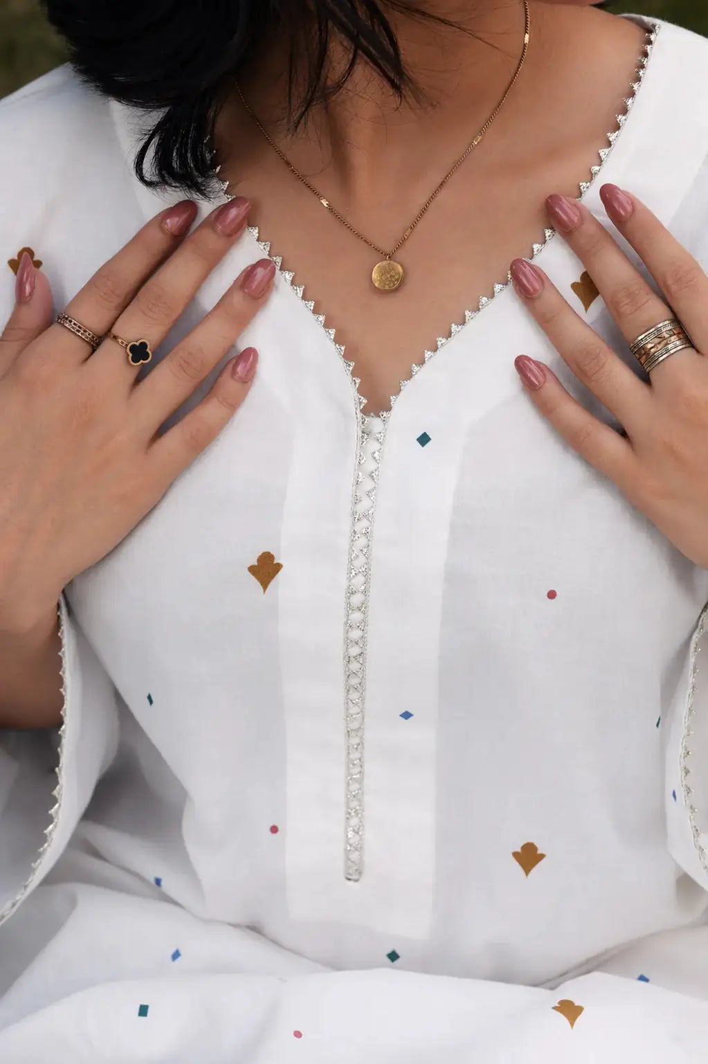 Alba lawn suit — back view of relaxed ivory print shirt with pastel medallion trouser, Sarah Tareen