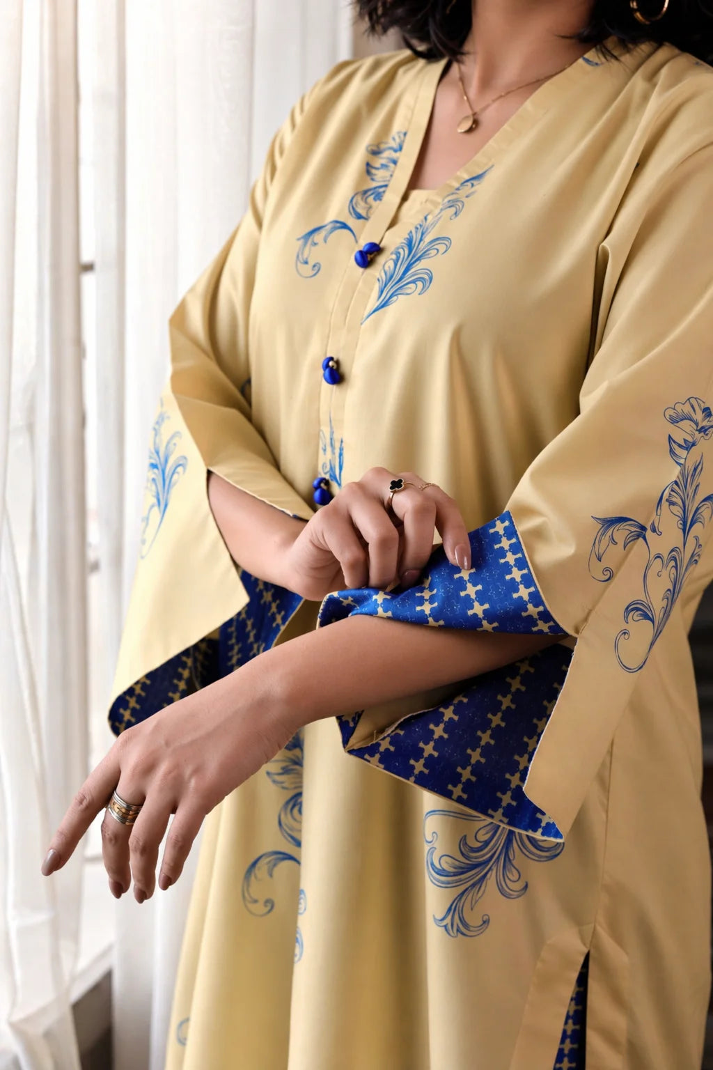 Aura cotton lawn suit — side view showing relaxed collar with button detail and wide palazzo trousers, Sarah Tareen
