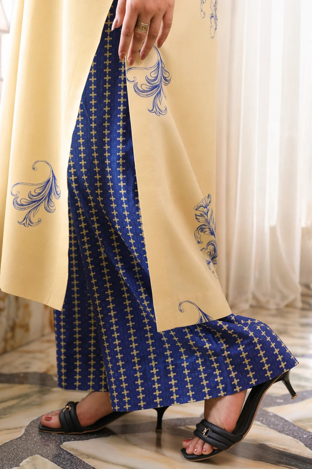 Aura cotton lawn suit — back view of cream shirt with scatter motifs and electric blue palazzo, Sarah Tareen
