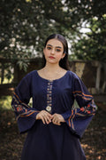 Lux cotton lawn suit — side view showing sharp placket neckline and warm rust contrast sleeves, Sarah Tareen