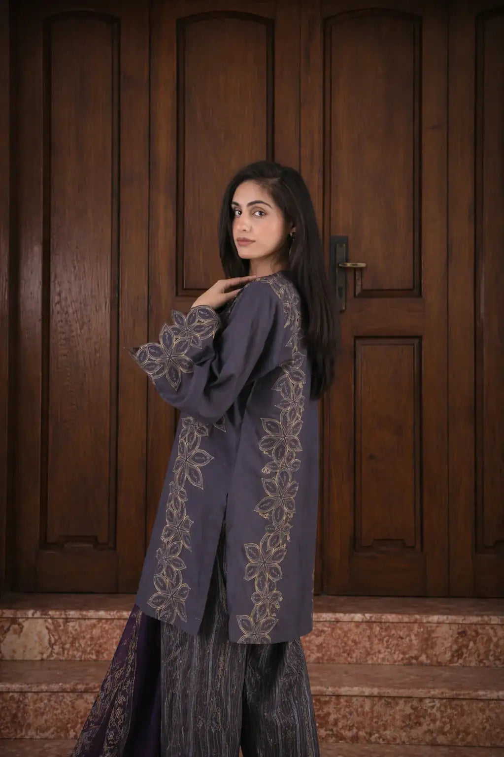 Dusk lawn suit — back view of metallic black print shirt with cutwork sleeves, Sarah Tareen