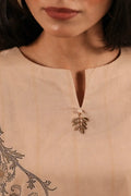 Ember cotton lawn suit — side view showing round neckline with slit and wide sleeves in camel print, Sarah Tareen