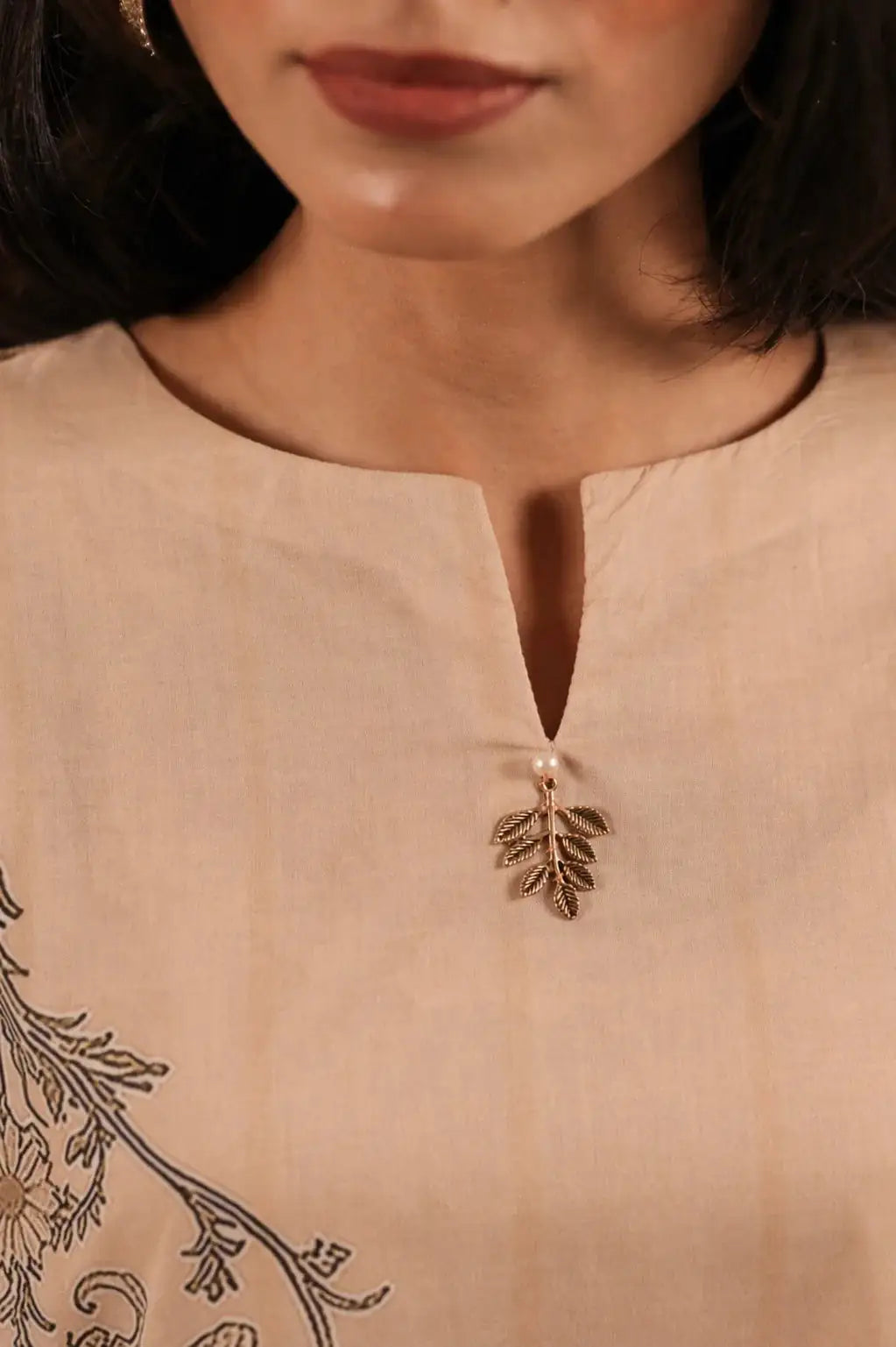 Ember cotton lawn suit — side view showing round neckline with slit and wide sleeves in camel print, Sarah Tareen