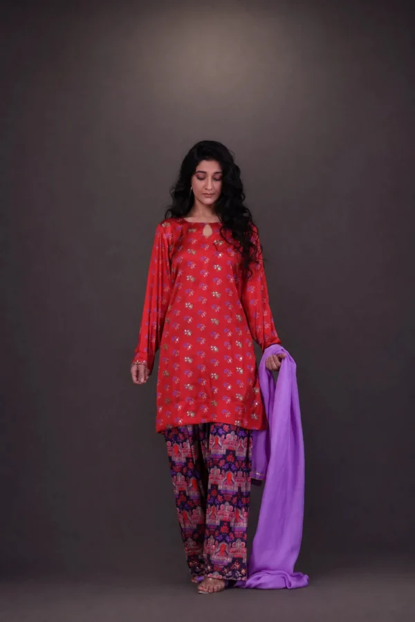 Model in coral red floral top with printed — Goonj