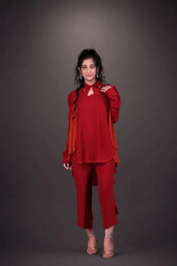 Model in deep red outfit with orange dupatta — Laal Nishaat